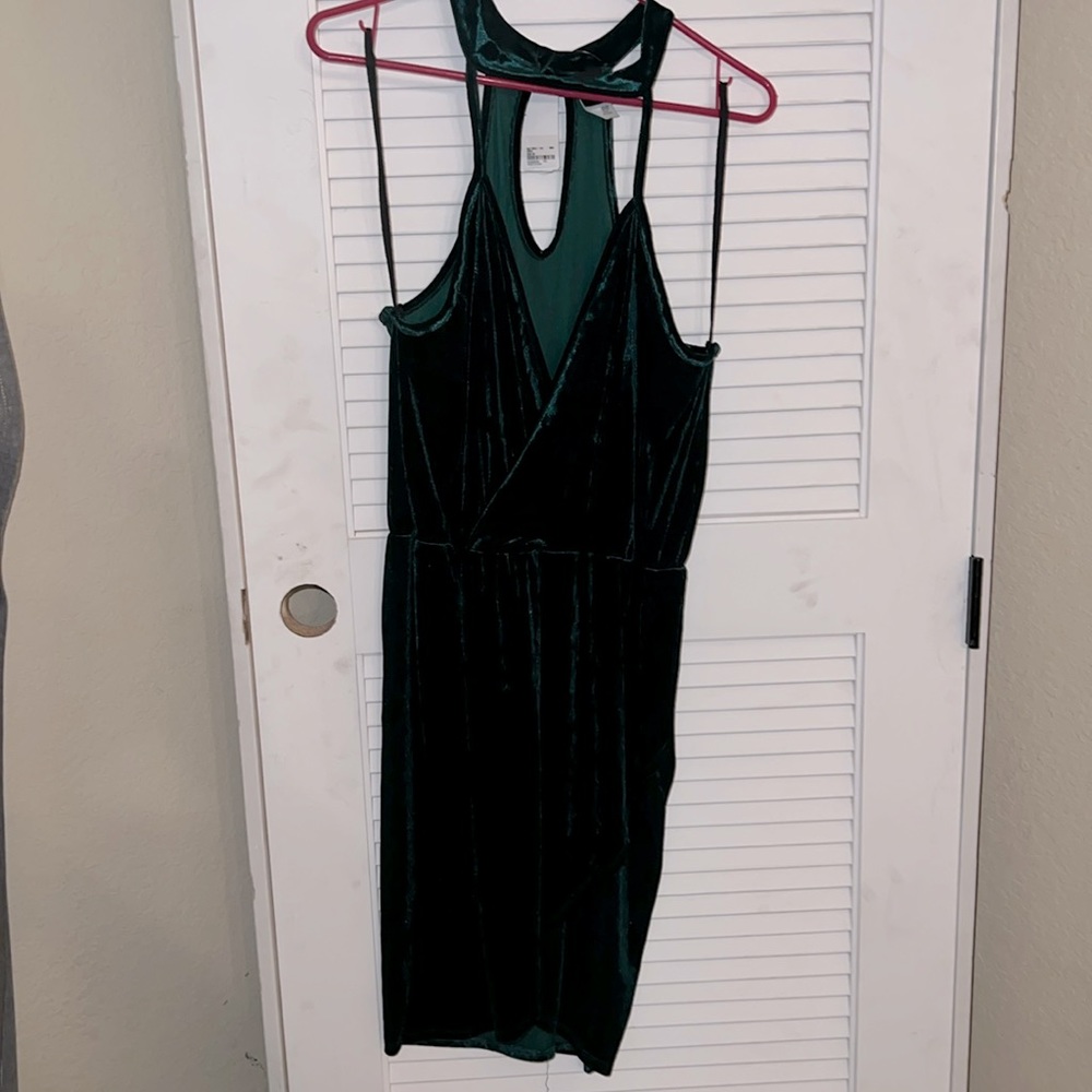 Rich green velvet cross body top and skirt.